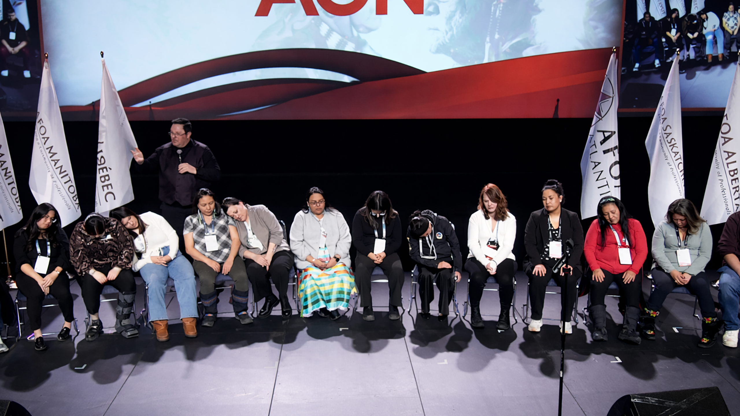 Hypnosis show volunteers on stage in front of an audience